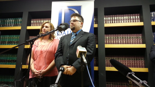 Joshua and Laura Cline address the media in Royal Oak, at the offices of the Dailey Law Firm (photo: Jon Hewett/WWJ).